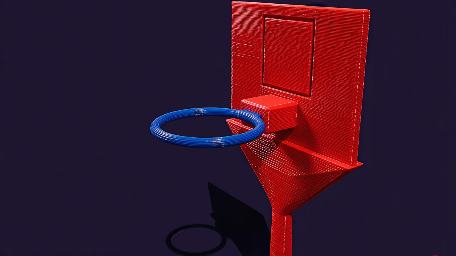 The red backboard with a shooter's square outlined on it and a blue rim held out from the board by a mounting block.