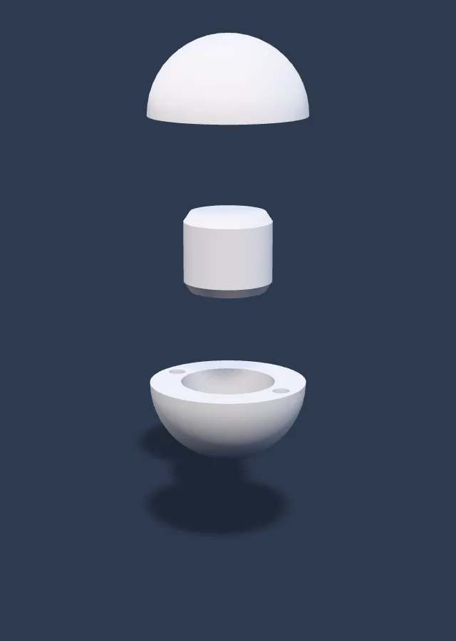A snowball opened up: two white half-shells with a short round weight between them.