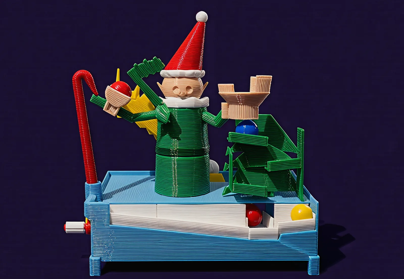 The elf face on: candy cane and throwing hand on the left, mitten and tree on the right, the white trough running along the front.