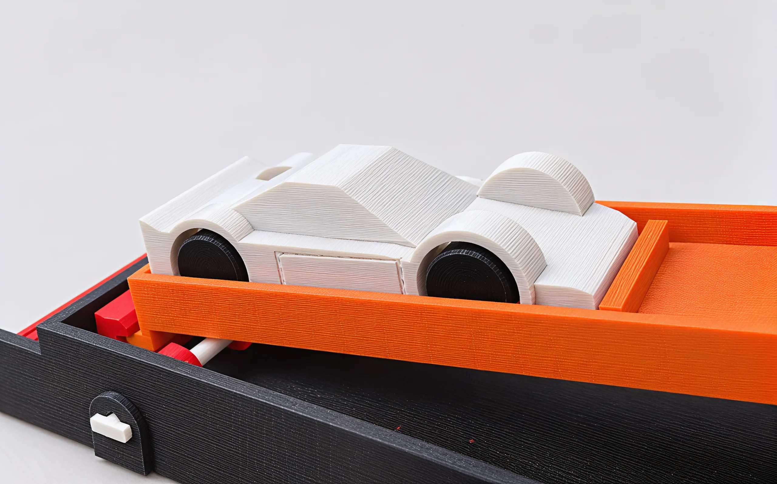 Close on the wedge car: a low faceted silver body over black wheels, seated in the paddle's raised rails