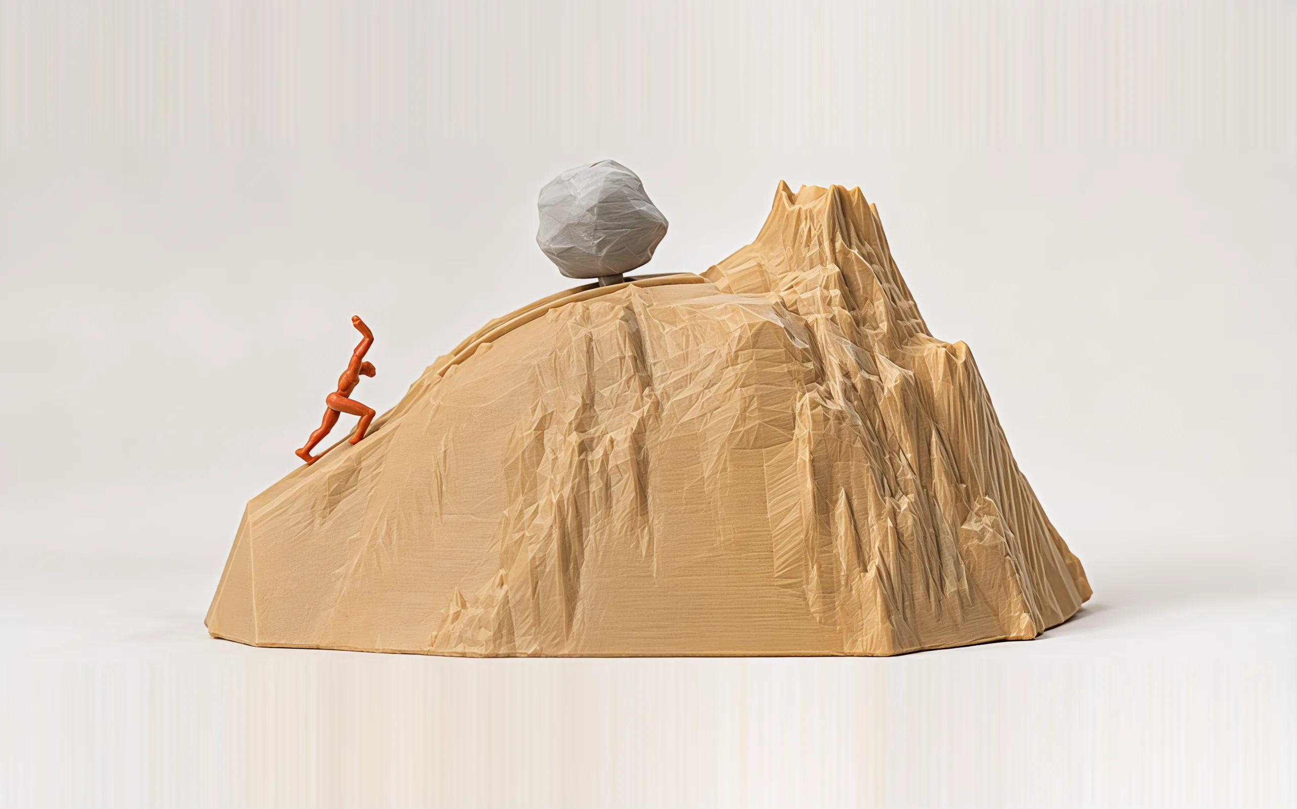 The boulder held at the top of the trail, just short of the summit, Sisyphus empty-handed below it