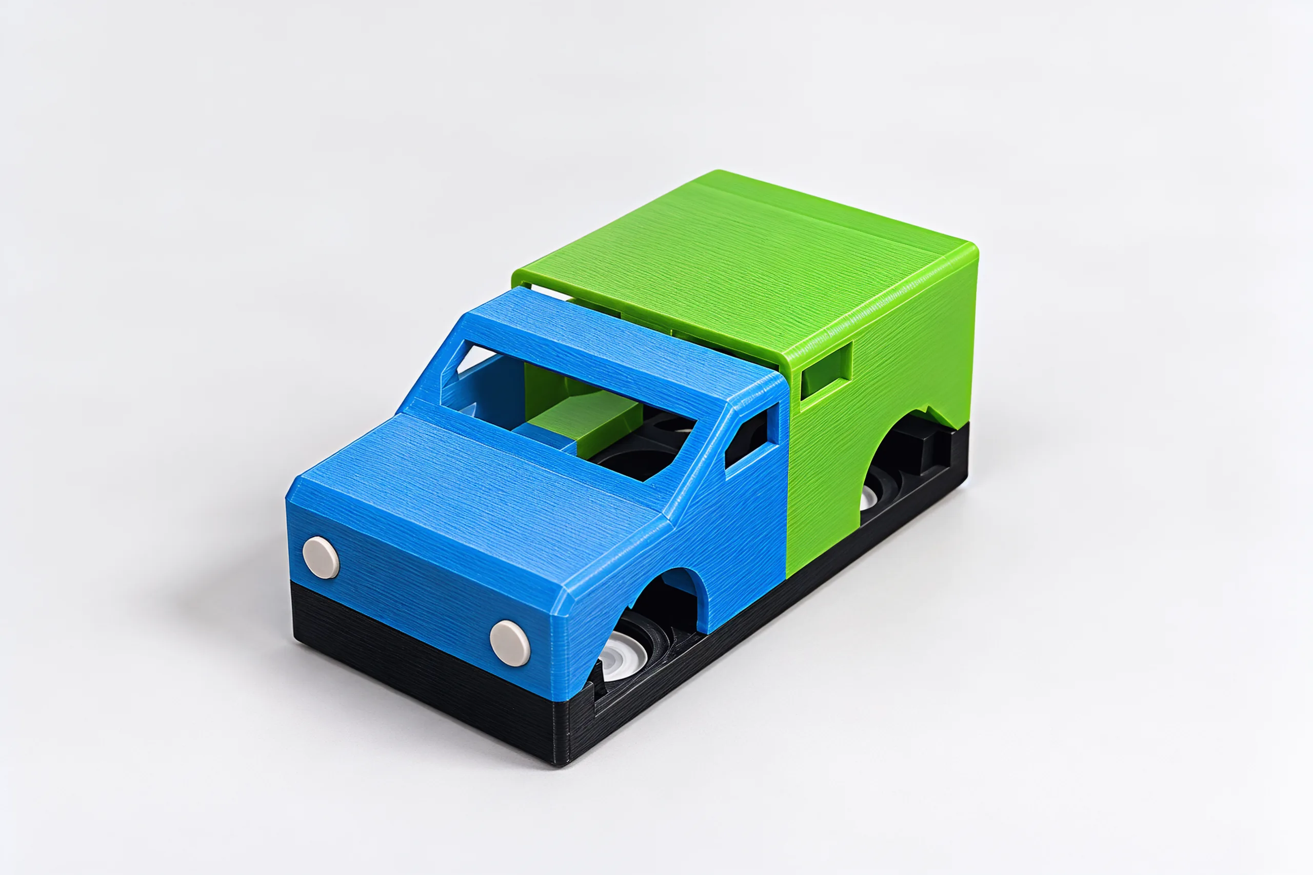 A blue hatchback front on a green off-roader back, sitting on a black chassis