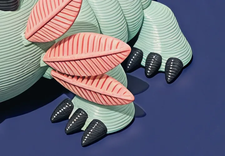 Mintfin's front feet close up: charcoal claws on mint feet under coral gill fronds