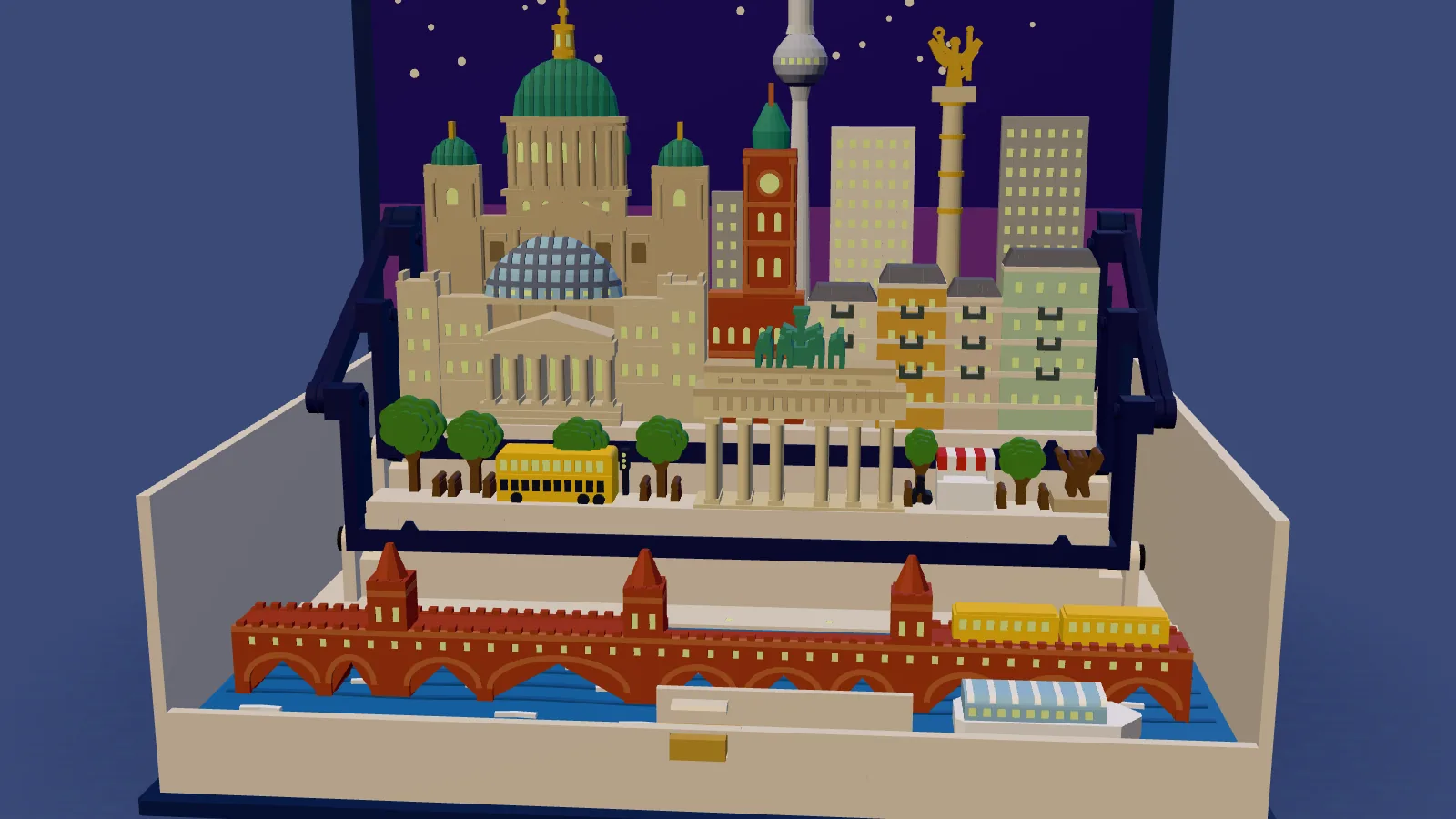 The whole Berlin set in the open navy book, seen from the front over the water: at the back a sandstone cathedral with copper-green domes and a gold lantern, a white tower with a silver ball, cream and gray slab blocks and a column with a gold winged figure against a dark indigo panel with cream stars; in front a sandstone parliament with a glass dome, a brick-red clock tower with a green spire and cream, ochre and pale green houses; then the street with green trees, a yellow double-decker bus, a sandstone gate of six columns with a green horse group, a red-and-white striped stall and a brown bear; in the cream tray, the blue river with white ripples, a long red-brick bridge on arches with three pointed towers and two yellow train cars on its deck, and a white boat with a pale blue glass roof