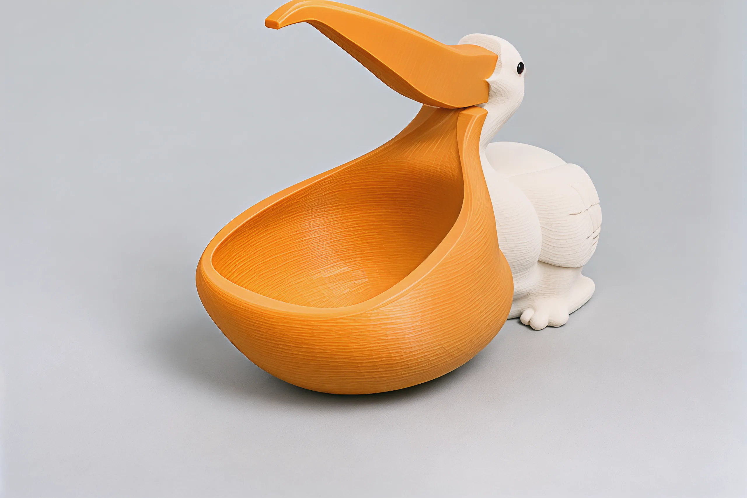 The pouch close up: a deep orange bowl with a rolled rim, rounded at the bottom, the bird sitting behind it