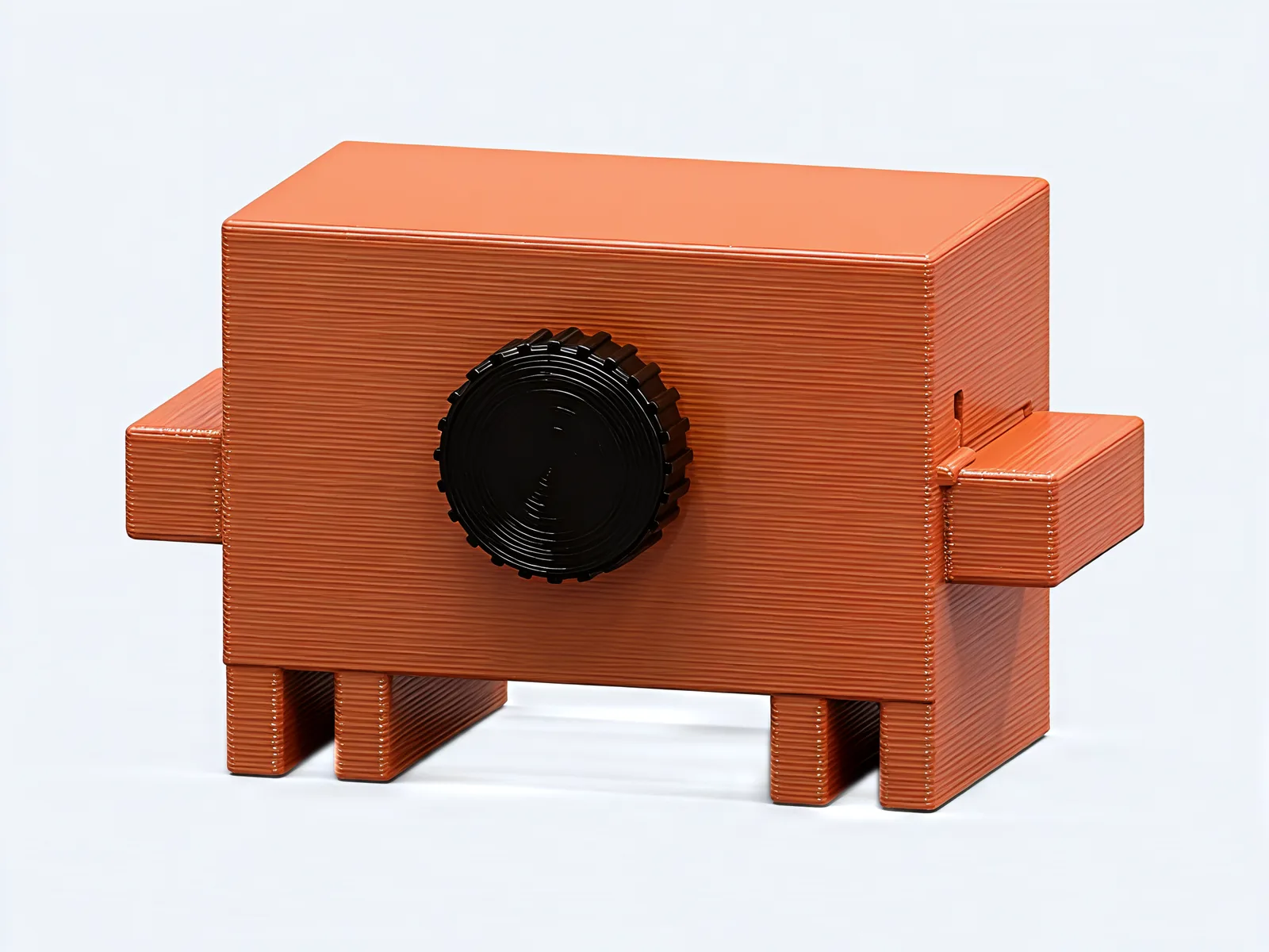 The back of the crab with its round black knurled knob in the middle