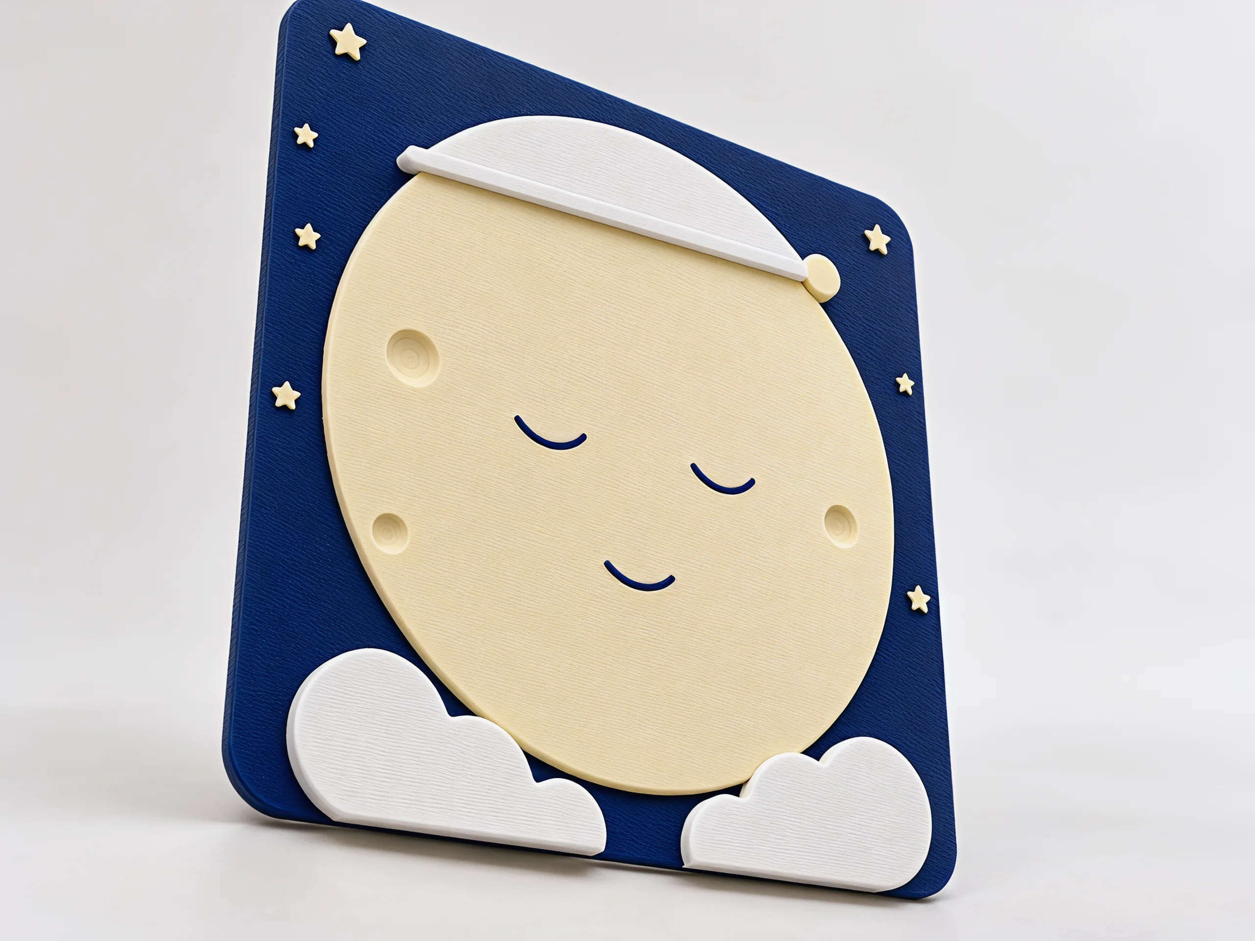 The plaque at an angle on a plain light background, the moon's face smooth and blank