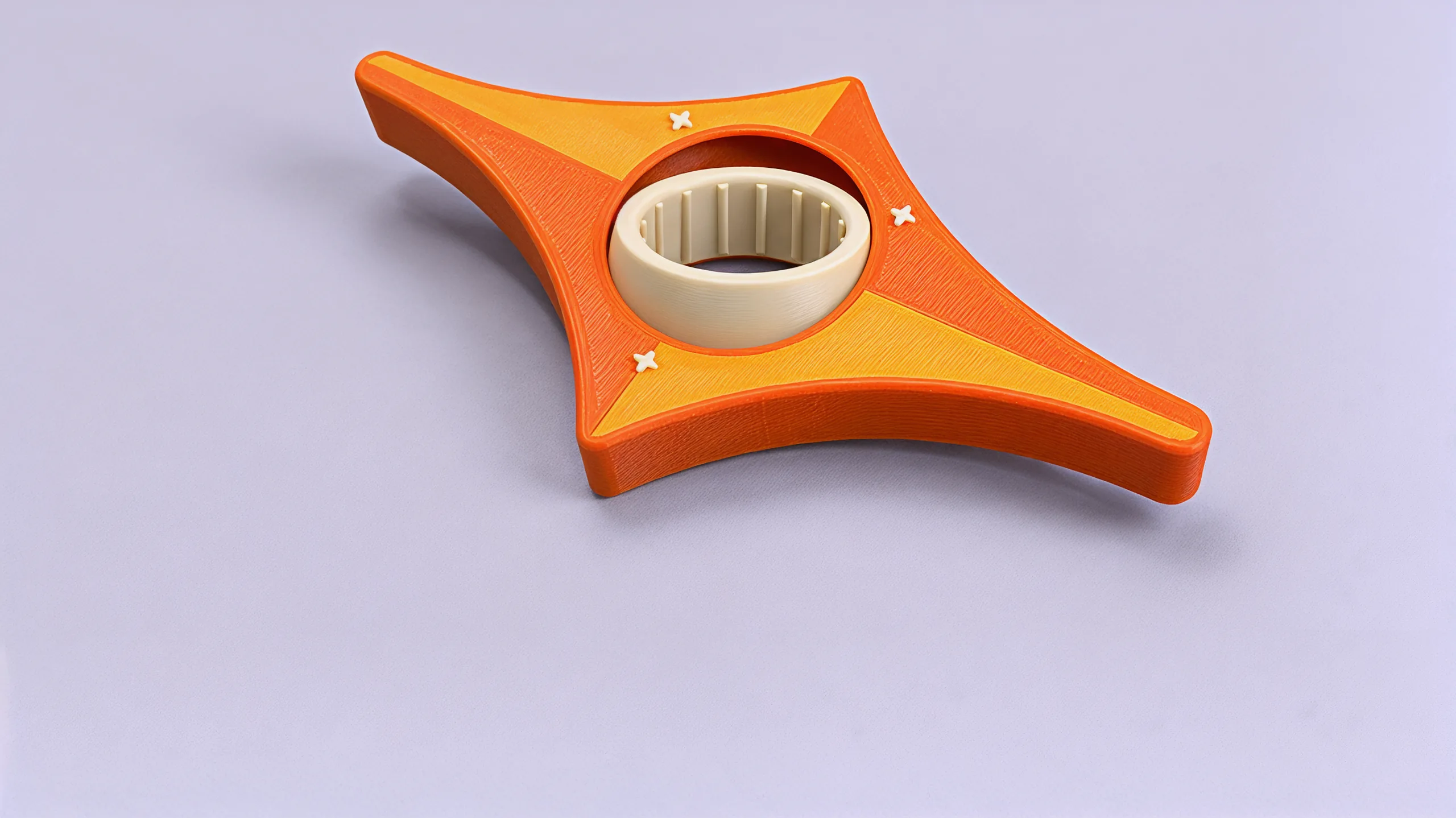 The cream ring tilted in the star, its rounded outside standing above the orange and gold face