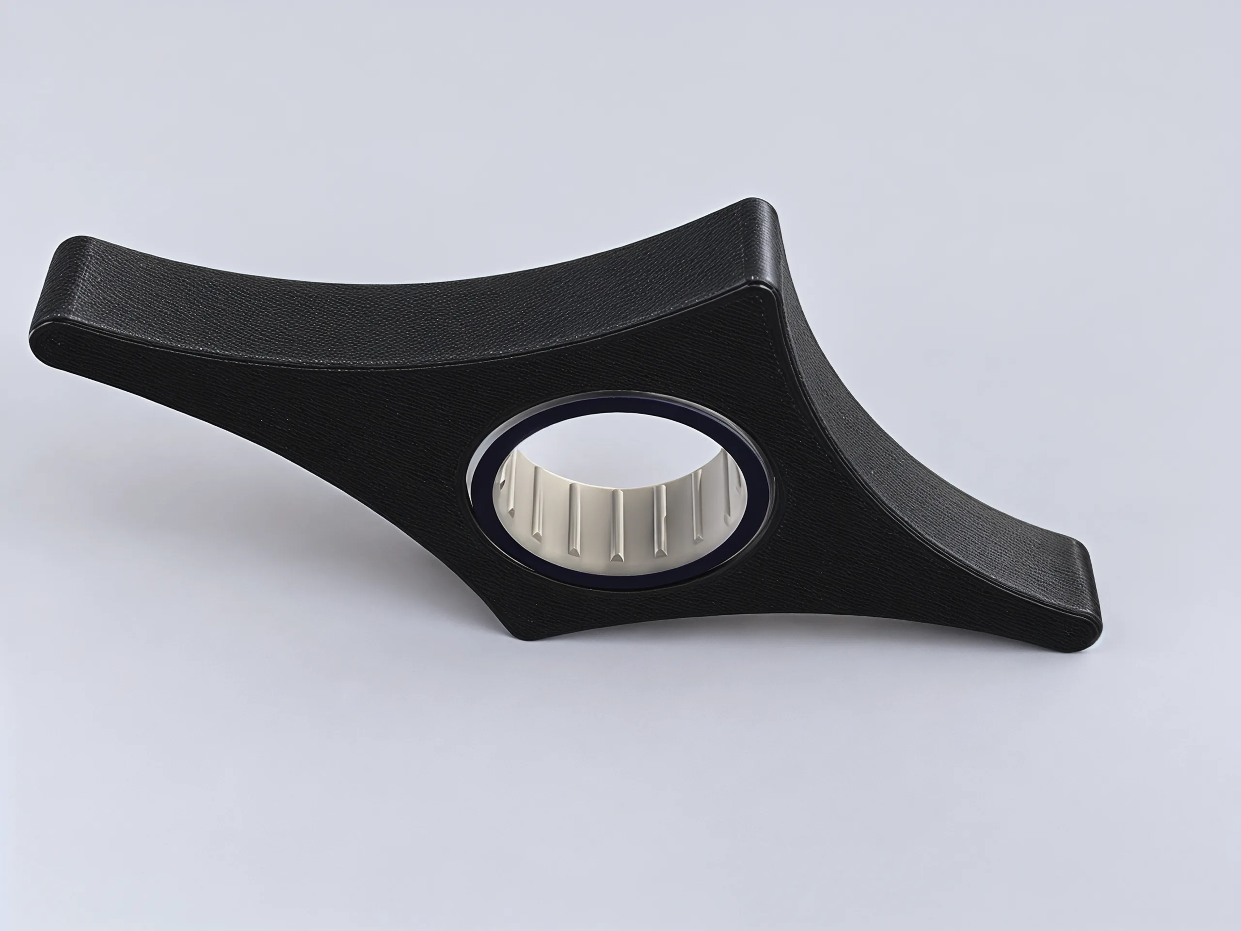 The underside of the holder: plain black, with the cream ring showing through its round seat