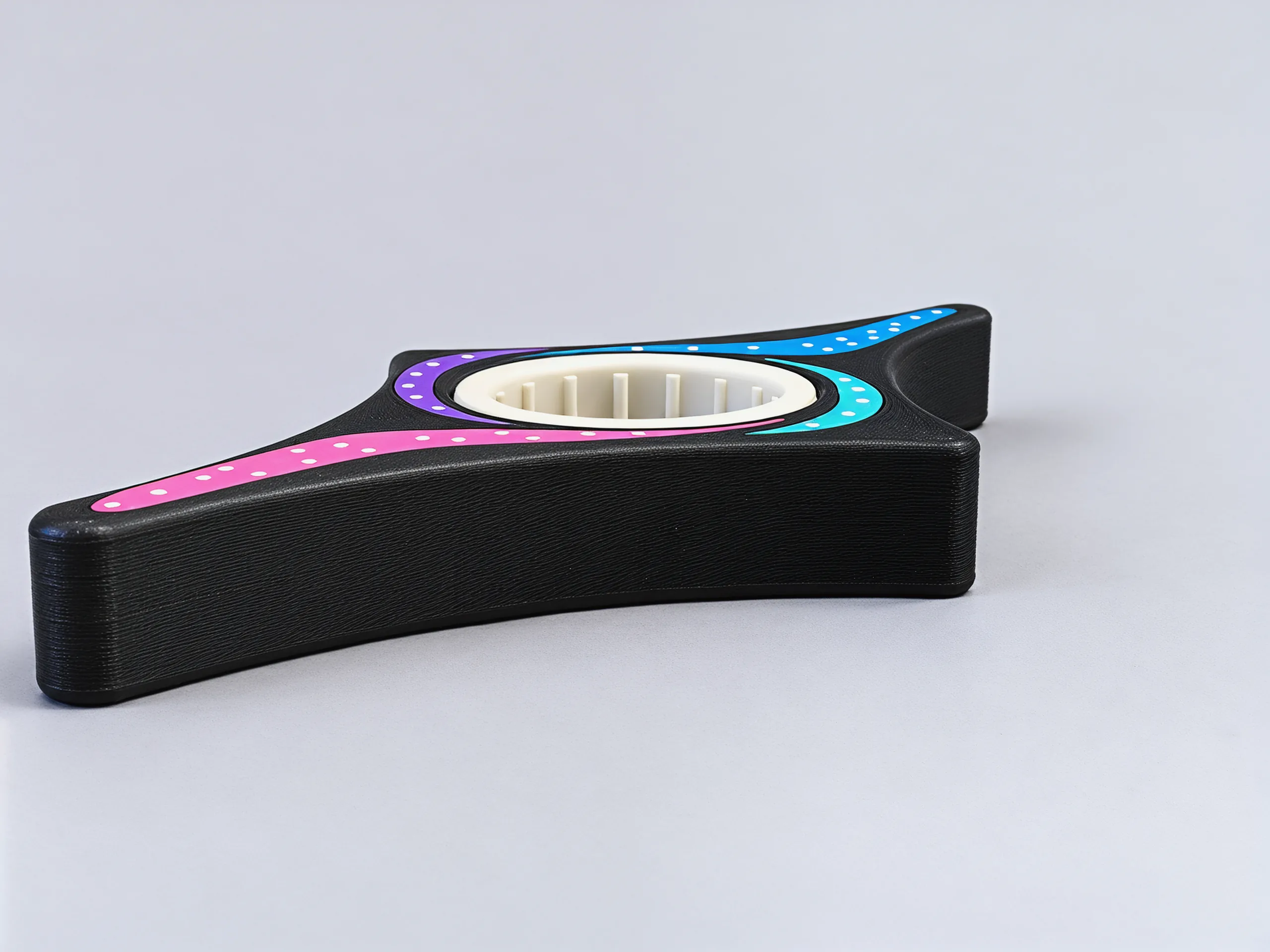 Low side view: a slim black frame with the ring sitting level with its top face